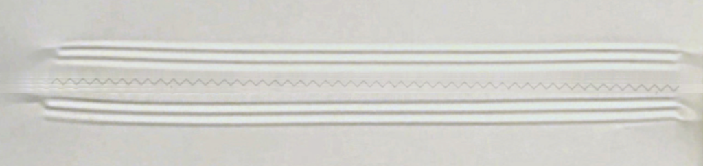 Adjustment screw style knife adjustment procedure for flow wrapper